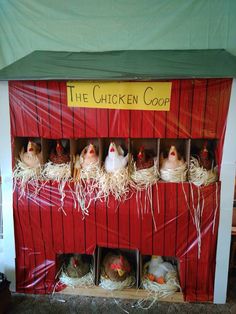 the chicken coop is made out of red barn sidings and has chickens in it