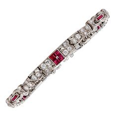 Square rubies, round diamonds, platinum, signed Tiffany & Co. Diamonds: 60 round diamonds with approximate total weight of 1.80 - 2.10 carats Size/Dimensions: 18.0 cm (7 in) Gross Weight: 26.2 grams Tiffany Victoria, Ruby Bracelets, Tiffany And Co Bracelet, Bracelet Art, Platinum Bracelet, 18k Gold Bracelet, Ruby Bracelet, Twisted Bracelet, Art Deco Bracelet