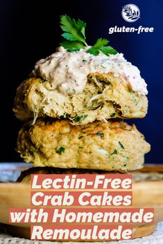 two crab cakes with homemade remoulade are stacked on top of each other