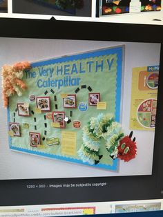 a computer screen with a bulletin board on it's side and flowers in the middle