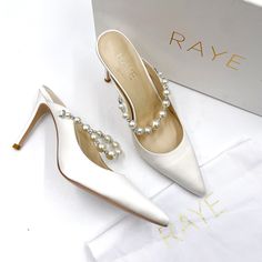 Raye Reception Heels Ivory Satin Crystal Pearl Mules Pointed Toe Stiletto Sz 6.5 Unworn Condition. There Are A Couple Of Light Marks From Being Handled In A Retail Environment. Satin Material Leather Lining Pointed Toe Stiletto Heel Pearl Strap At Front Slip On Pearl White Ankle Strap Heels For Formal Occasions, Elegant Closed Toe Wedding Shoes With 4-inch Heel, Pearl White Wedding Shoes For Formal Occasions, Pearl White Pointed Toe Wedding Shoes For Party, Pearl White Round Toe Heels For Evening, White 4-inch Heel Heels For Gala, Pearl White Evening Heels With Round Toe, Elegant White Ankle Strap Kitten Heels, Pearl White Closed Toe Wedding Shoes For Evening