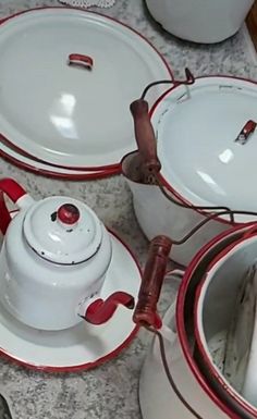 red and white dishes are sitting on the table