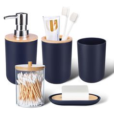 bathroom accessories including toothbrushes, soap dispenser and cup