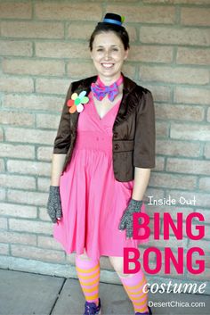 a woman in pink dress and brown jacket standing next to brick wall with text overlay reading inside out bing bong costume