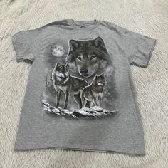 Women’s Wolf Pack Gray T Shirt Size Medium New. The T Shirt Has An Image Of Wolfs On The Front. It Comes From A Smoke Free Home. Pit To Pit: 20 1/2” Length: 27” Graphic Tee With Wolf Design, Short Sleeve, Graphic Tee With Wolf Design Short Sleeve, Wolf Design Graphic Tee With Short Sleeves, Santa Tee, Wolf Shirt, Wolf T Shirt, Cute Graphic Tees, Cat Graphic, Cat Graphic Tee