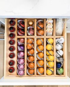 an open drawer filled with lots of different types of balls