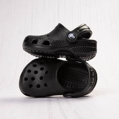 Crocs Classic Clog - Baby / Toddler - Black | Journeys Black Clogs With Cushioned Footbed For Outdoor Activities, Casual Black Clogs For Outdoor Activities, Black Casual Clogs For Outdoor Activities, Comfortable Black Clogs For Outdoor Activities, Slip-resistant Solid Color Clogs For Outdoor, Black Synthetic Clogs For Outdoor Activities, Black Breathable Synthetic Clogs, Outdoor Slip-resistant Solid Clogs, Outdoor Slip-resistant Clogs