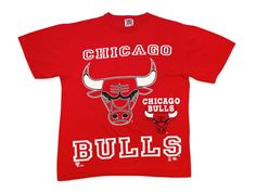 "Vintage Chicago Bulls shirt, undated from the 90s. Single-sided design printed on 100% cotton Brand: Team Rated Tag Size: L Measurements: Pit to pit -- 23\" / Length -- 28.5\" Condition: 7/10 -- in good shape overall with minor cracking to graphics, some small stains on the torso, lower back, and upper back, and a pinhole above the back bottom hem. See last 5 pics for details" 90s Logo Print Sports Top, 90s Style Sports Event Logo Print Tops, 90s Graphic Print T-shirt For Fan Gear, 90s Logo Print Tops For Sports Events, 90s Style Graphic Print T-shirt For Fans, Vintage Team Logo Tops For Streetwear, Vintage Streetwear Tops With Team Logo, Vintage Tops With Team Logo For Streetwear, 90s Graphic Print Tops For Fan Gear