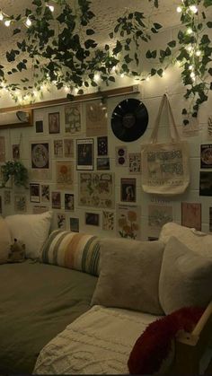 a living room filled with furniture and lots of pictures on the wall next to it