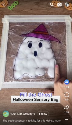 someone is making a ghost with cotton balls in the shape of a bag for halloween