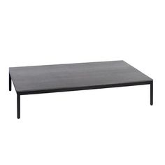 a black table sitting on top of a white floor