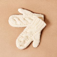 Our Cable Knit Wool Mittens are the ultimate warmers for your hands this winter. Individually knitted by hand in Australia, our Wool Mittens feature a chunky cable knit pattern in a luxurious Australian Merino wool blend. Our Cable Knit Wool Mittens will be your favourite accessory, or serve as the cutest Australian gift for a loved one close to you. One size fits all Individually hand knitted in Australia Warm hand wash only