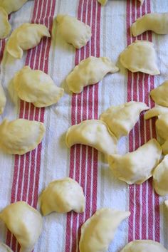 some dumplings are sitting on a red and white towel