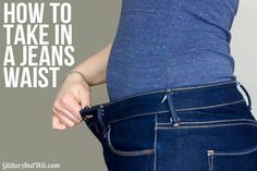 a woman is holding her jeans in the waist