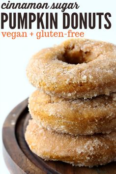 three sugary pumpkin donuts stacked on top of each other with text overlay