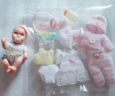 there are baby dolls and other items in the package