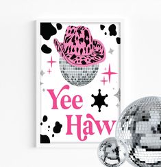 there is a disco ball next to a poster with the words yee haw on it