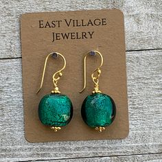 Stunning, vibrant emerald green! The foil lined beads are used in these earrings are 17 x 10mm and disk shaped. The ear wire, headpins and accent beads are vermeil gold. Total length of the earrings: 1.5 inches including the ear wire. To see more from East Village Jewelry~ http://eastvillagejewelry.etsy.com All orders ship out within 24 hours, excluding holidays and Sundays Feel free to contact me with any questions. Use coupon code VILLAGE14 for 10% off all orders over $200.00 THIS ITEM WILL SH Sunday Feels, East Village, Head Pins, Ear Wire, Glass Earrings, Green Glass, Coupon Codes, Gold Vermeil, Foil