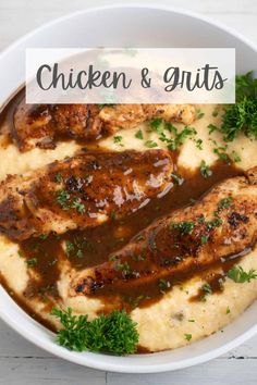 chicken and grits with gravy in a white bowl