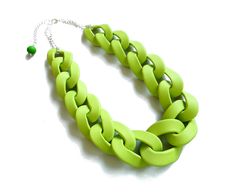 "Oversized chunky chain necklace entirely handmade link by link from polymer clay in apple green finished with silver plated chain. Unique yet versatile statement necklace in neutral shade, ideal for color matching with various outfits. Length: See the drop down menu for options // Modeled necklace is 18 inches (46 cm). All necklaces come with extender for extra 2\" (5-6cm). Lobster clasp closure on the back. Chain links are approx 2 -1 1/2 long inch and smaller in the ends of the necklace and e Trendy Green Chain Link Jewelry, Green Chain Link Necklace With Adjustable Chain, Green Necklace With Adjustable Chain, Green Adjustable Chain Link Necklace, Green Chunky Chain Necklace As Gift, Trendy Green Adjustable Chain Necklace, Trendy Green Chain Necklace With Adjustable Chain, Bold Handmade Green Jewelry, Back Chain