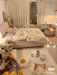 a bed room with a neatly made bed and teddy bears on the floor next to it