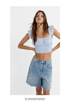 Embroidered crop top with a gathered straight neckline and wide ruffled straps. Elasticated smocked waist. Open back with drawstrings and tie detail. Available in several colours.