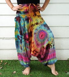 "💥One Size Fits Most Comfortable Low Cut Drop Crotch Tie Dye Harem Pants, Hippie Pants, Tie Dye Baggy Pants, Festival Harem Pants, Festival Clothing, Tye Dye Genie Pants, Tie Dye Comfy Pants 👉Fabric: Soft and Breathable Rayon 👉Smocked Elasticated Waist: 26\" up to 54\" 👉Hips up to: 60\" 👉Total Length: 39\" (Top to Bottom) 👉 Around elastic ankle 10\" 👉 Tie Dye Method 👉 One Size Fits M-XL or US 2-20 👉Extremely Comfortable 👉Boho/Hippie Theme, Beach Wear/Festival Going Pants Note: Due to t Hippie Relaxed Fit Harem Pants For Summer, Multicolor Cotton Harem Pants For Summer, Summer Hippie Relaxed Fit Harem Pants, Summer Multicolor Cotton Harem Pants, Relaxed Fit Harem Pants For Summer Festivals, Summer Hippie Harem Pants With Loose Fit, Summer Hippie Harem Pants With Loosely Fitted Hips, Hippie Cotton Parachute Pants For Summer, Baggy Multicolor Harem Pants For Summer