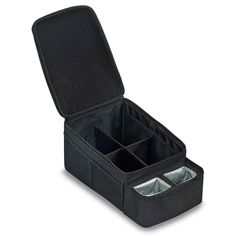 an open black case with four compartments on the inside and two silver cups in it