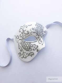 You can wear this Phantom of the Opera Musical inspired mask with comfort for long hours. Perfect for Masquerade balls, Wedding and Proms! You can pick custom color option if you would like a customized mask in a different color to match your attire/theme S H I P P I N G - Processed same day or within 24 hours. 1-2 day guaranteed delivery services offered, add items to cart and click on shipping tab for rates. Pls leave a check out note with your need date & contact number (especially for ex White Formal Masquerade Mask For Carnival, Venetian White Full Face Mask, White Venetian Full Face Mask, White Venetian Full-face Mask, White Full Face Mask For Masquerade, White Eye Mask For Masquerade, Venetian White Eye Masquerade Mask, White Venetian Eye Masquerade Mask, White Venetian Masks For Masquerade