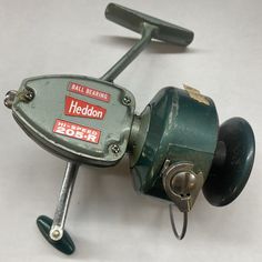 an old fishing reel on a white background