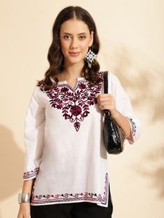 Elevate your wardrobe with this stunning handmade White Straight Kurti, featuring exquisite floral embroidery. Designed with a round neck and three-quarter regular sleeves, this kurti showcases intricate Aari work detail, adding a touch of traditional elegance. Crafted from machine-woven pure cotton, it promises both comfort and durability. Size & Fit: - The model (height 5'8") is wearing a size S. Material & Care: - Pure Cotton - Easy care and maintenance.  Perfect for both casual outings and s Festive White Kurta With Embroidered Neckline, Festive Embroidered Kurta With 3/4 Sleeves, Festive 3/4 Sleeve Embroidered Kurta, Eid Kurta With Floral Embroidery And 3/4 Sleeve, Spring Embroidered Kurta With 3/4 Sleeves, Spring Embroidered Neckline Straight Kurta, Spring Straight Kurta With Embroidered Neckline, Summer Straight Kurta With Embroidered Hem, Traditional Floral Embroidered Kurta With 3/4 Sleeves