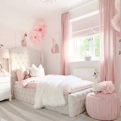 a bedroom decorated in pink and white