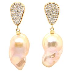 Amp up the glamour with these stunning Diamond Teardrop Natural Baroque Pearl Drop Earrings. Featuring hand selected golden hued natural baroque earrings dangling from a highly polished yellow gold Teardrop with 1.30ct of sparkling diamonds, perfectly complementing the luminosity of natural shades of golden peach pink. The freshwater pearls have been hand selected for their imperfect shape, and rich warm golden hued luster. These earrings are a timeless modern classic for a pearl lover looking f Luxury Drop Pearl Earrings, Luxury Teardrop Earrings With High Luster, Luxury Yellow Gold Drop Pearl Earrings, Luxury Pear-shaped Pearl Drop Diamond Earrings, Luxury Pear-shaped Pearl Earrings, Luxury Pear-shaped High Luster Pearl Earrings, Luxury High Luster Pear-shaped Pearl Earrings, Luxury Gold Pear-shaped Diamond Earrings, Baroque Earrings