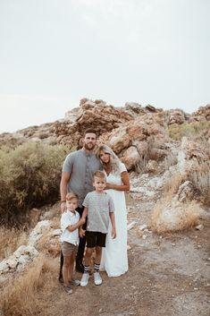 a family posing for a photo in the desert