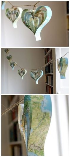 three pictures of hearts hanging from a string in the shape of bookshelves with maps on them