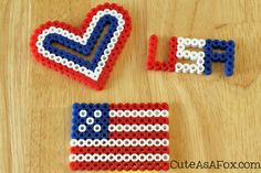 two pieces of plastic bead art made to look like the american flag and peace sign