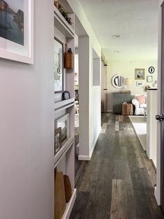 the hallway is clean and ready to be used as a living room or dining area