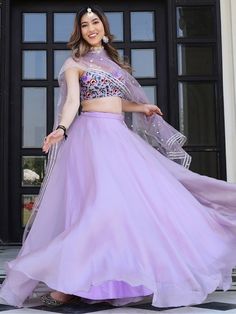 Introducing the fabulous lavender organza lehenga with embroidered choli, a stunning piece that will capture hearts and turn heads wherever you go. Made with high-quality lavender color organza net material, this lehenga is a true work of art. Its exquisite design and attention to detail make it perfect for receptions, weddings, festivals, and parties.
This lehenga is a similar color choli, which is embellished with organza net material and multi-thread embroidery. This intricate embroidery adds Lavender Organza Dress, Reception Dresses For Women, Organza Lahanga Design, Lavender Lehanga Combinations, Organza Lehenga For Women, Net Choli Designs Latest, Levender Haldi Outfit, Lavender Color Outfit, Lavender Outfits For Women