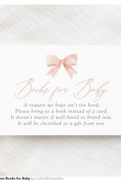 a card with a pink bow on it that says book for baby, and the text reads