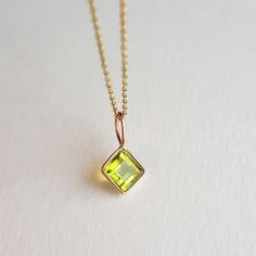 ✪Gold weight: 430 milligram ✪Stone size: 6 mm ✪Bail size: 5.2 mm ✪Total length: 14 mm ✪Metal: 18k solid rose gold ✪Gemstone: Peridot ✪Setting type: Bezel setting If you need any other preferred stone please contact us. QUALITY OF MATERIALS: Metal: Most of our jewelry at JewelryMansion is made with precious metals like gold and silver. These metals are 100% non-allergic to our skin. Gemstone: All of our jewelry is made by handpicked gemstones. Due to the nature of these gemstones a slight variation in colors may be noticed between the pictures and the real piece. Although we guarantee that this is barely noticeable. Real gemstones naturally consists of inclusions. In other words these gemstones may have very small barely noticeable cracks trapped inside the stones. This characteristics of g Yellow Peridot Birthstone Jewelry, Yellow Peridot Jewelry Gift, Gold Peridot Round Pendant Necklace, Peridot Gemstone Pendant Necklace, Green Peridot Pendant Necklace, Rose Gold Charms, Peridot Pendant, Charm Gift, August Birth Stone