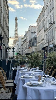 the tables are set outside in front of the eiffel tower