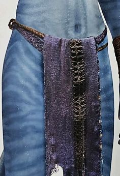 an image of a man with chains attached to his waist and wearing a blue outfit