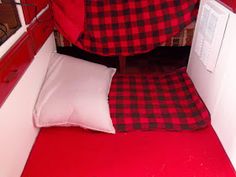 red and black checkered bedspread with white pillows