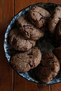 a plate full of cookies on top of a wooden table