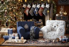 a living room filled with furniture and christmas decorations