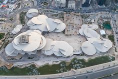 an aerial view of a building with many circular structures