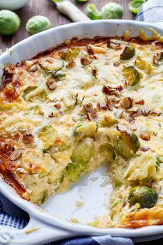 a close up of a casserole dish with broccoli and cheese on it