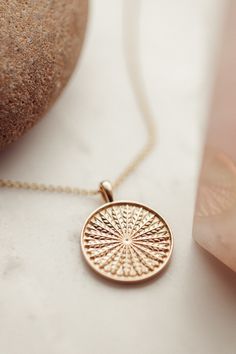 14k gold circle pendant necklace with a feather texture. Available in rose, yellow, or white gold. Feather Texture, The Ascent, Circle Pendant Necklace, Gold Circle, Rose Yellow, Tie The Knots, Circle Pendant, White Gold, Pendant Necklace