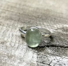 Minimalist Apple Green Brazil Oval Prehnite Elegant Solitaire Sterling Silver Ring | Green Gemstone Ring | Solitaire Ring | Engagement Ring by GildedBug on Etsy Oval Green Amethyst Jewelry, Green Oval Moonstone Gemstone Ring, Green Oval Moonstone Ring, Oval Green Moonstone Gemstone Ring, Minimalist Green Oval Jewelry, Green Oval Prehnite Rings, Green Oval Moonstone Ring In Sterling Silver, Green Moonstone Ring In Sterling Silver, Green Sterling Silver Moonstone Ring