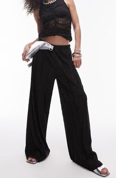 Textured plissé pants are fashioned with breezy wide legs for a look that flies for fun or fancy. 29" inseam; 28" leg opening; 12 1/2" front rise; 16 1/2" back rise (size Medium) Elastic waist 100% polyester Machine wash, dry flat Imported Chic Pleated Wide Leg Bottoms, Chic Pleated Wide-leg Bottoms, Pleated Wide Leg Pants For Summer, Trendy Pleated Solid Bottoms, Chic Pleated Summer Pants, Trendy Pleated Solid Color Bottoms, Versatile Straight Leg Evening Bottoms, Pleated Straight Leg Bottoms For Summer, Summer Pleated Straight Leg Bottoms